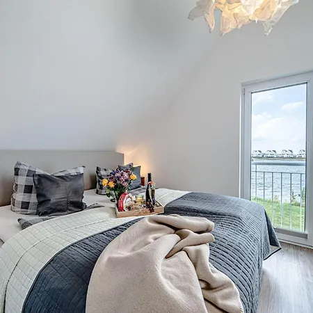 Дом отдыха Ferienhaus-an-der-ostsee-by-seeblick-ferien-oro-direkte-wasserlage-sauna-e-saeule Ольпениц